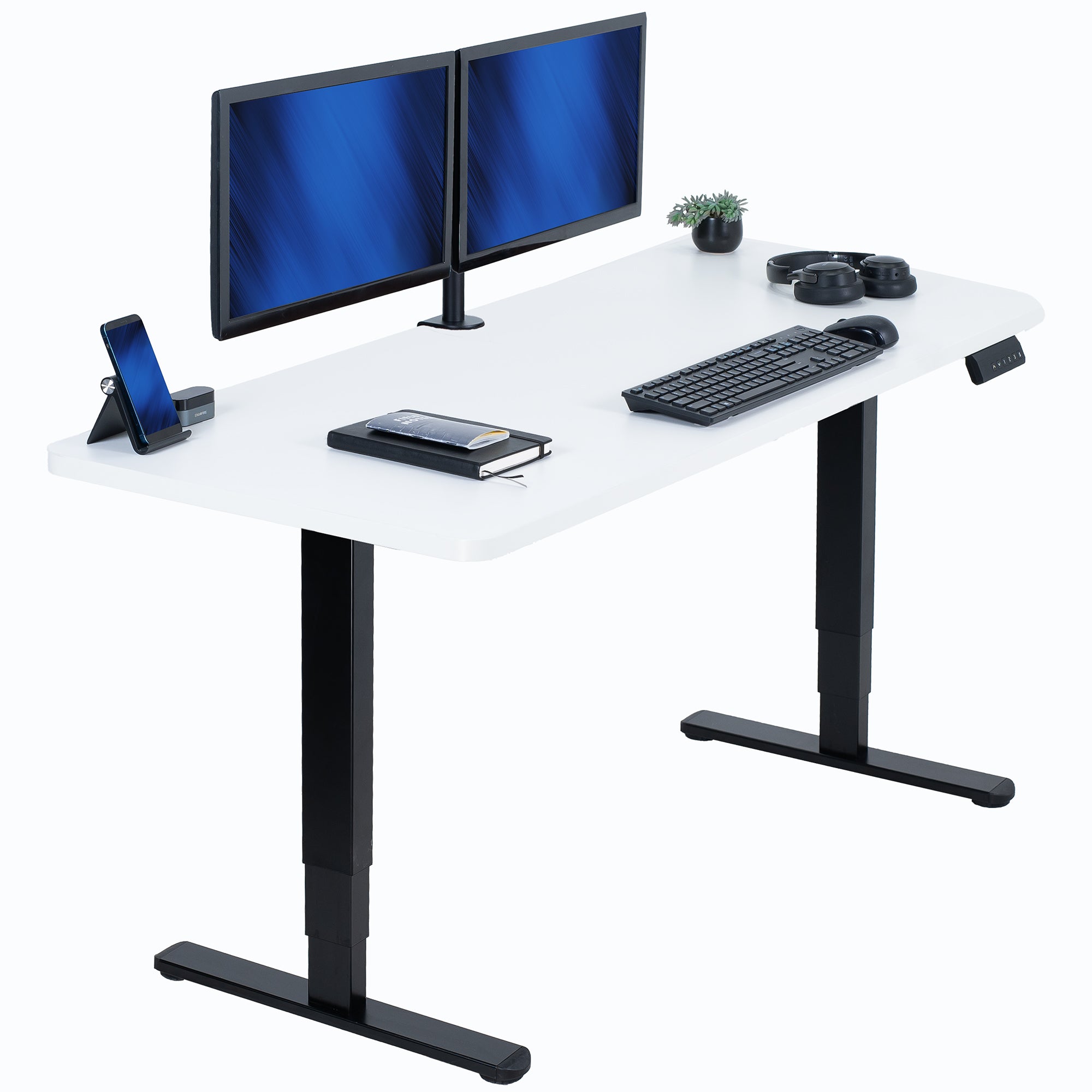 White desk with black legs, two monitors, keyboard, and other office items on a white background