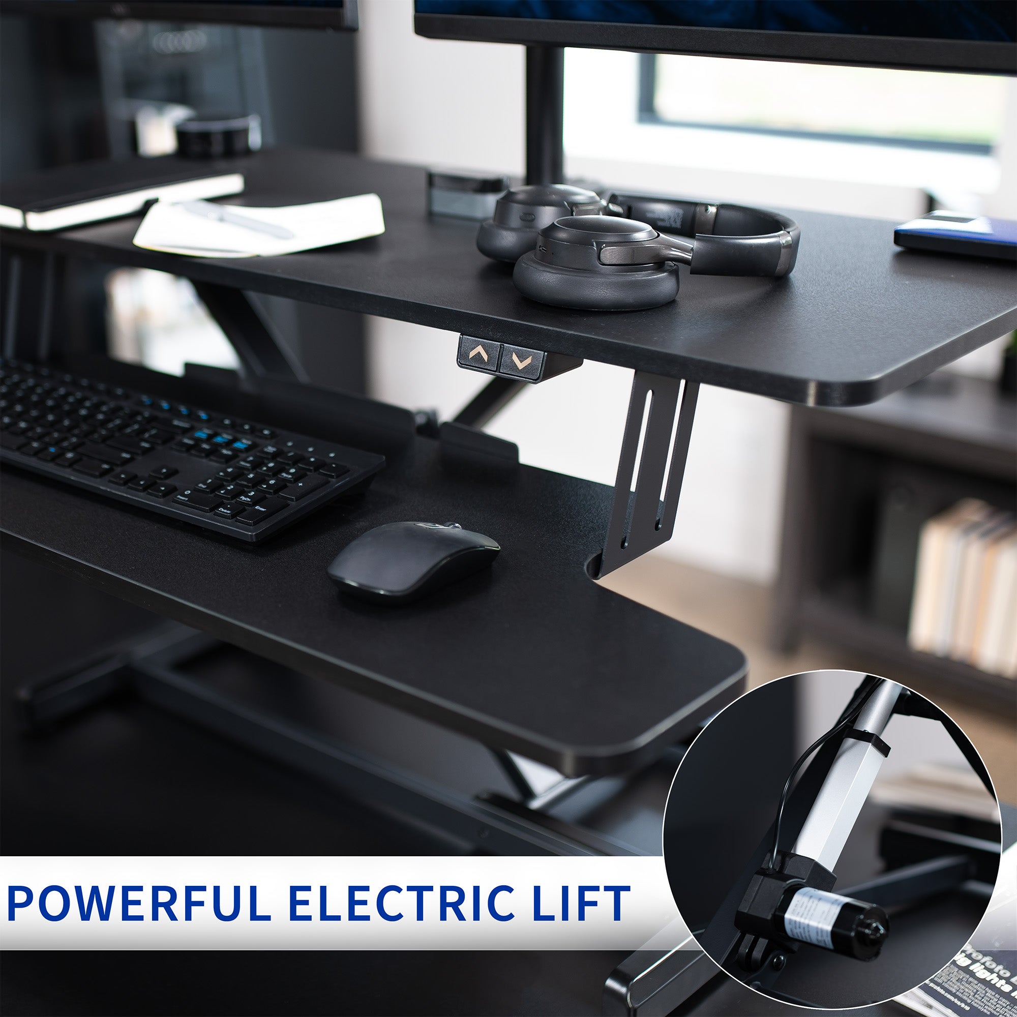 Sit to stand desk riser and dual monitor mount with electric height adjustment.