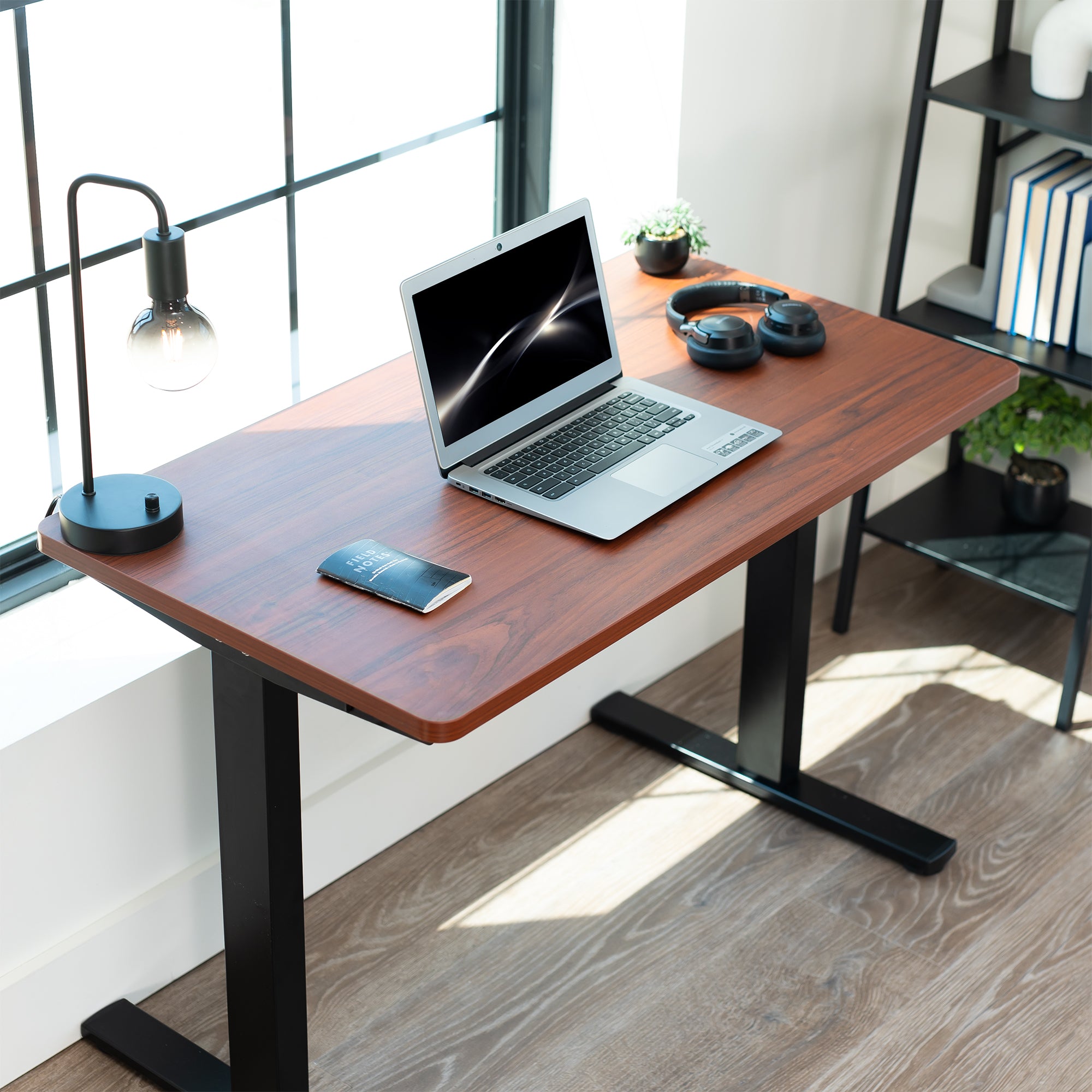 Dark Walnut 43in x 24in Particle Board Table Top on black frame in office setting