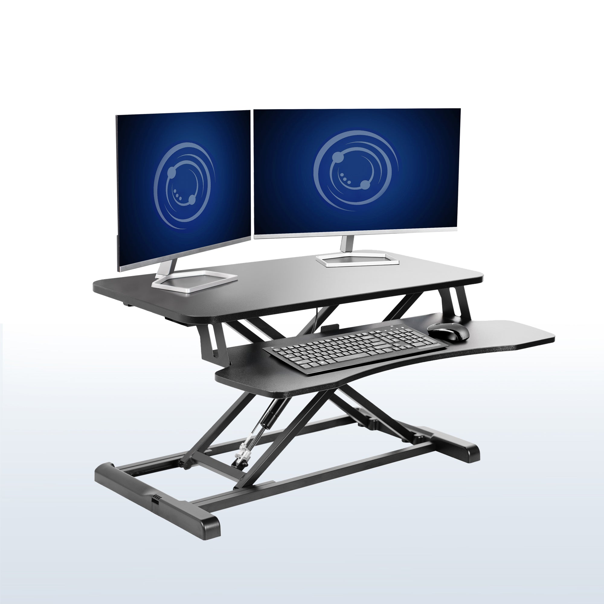 Sturdy height adjustable 2-tiered desk riser for ergonomic office workstation in office setting.
