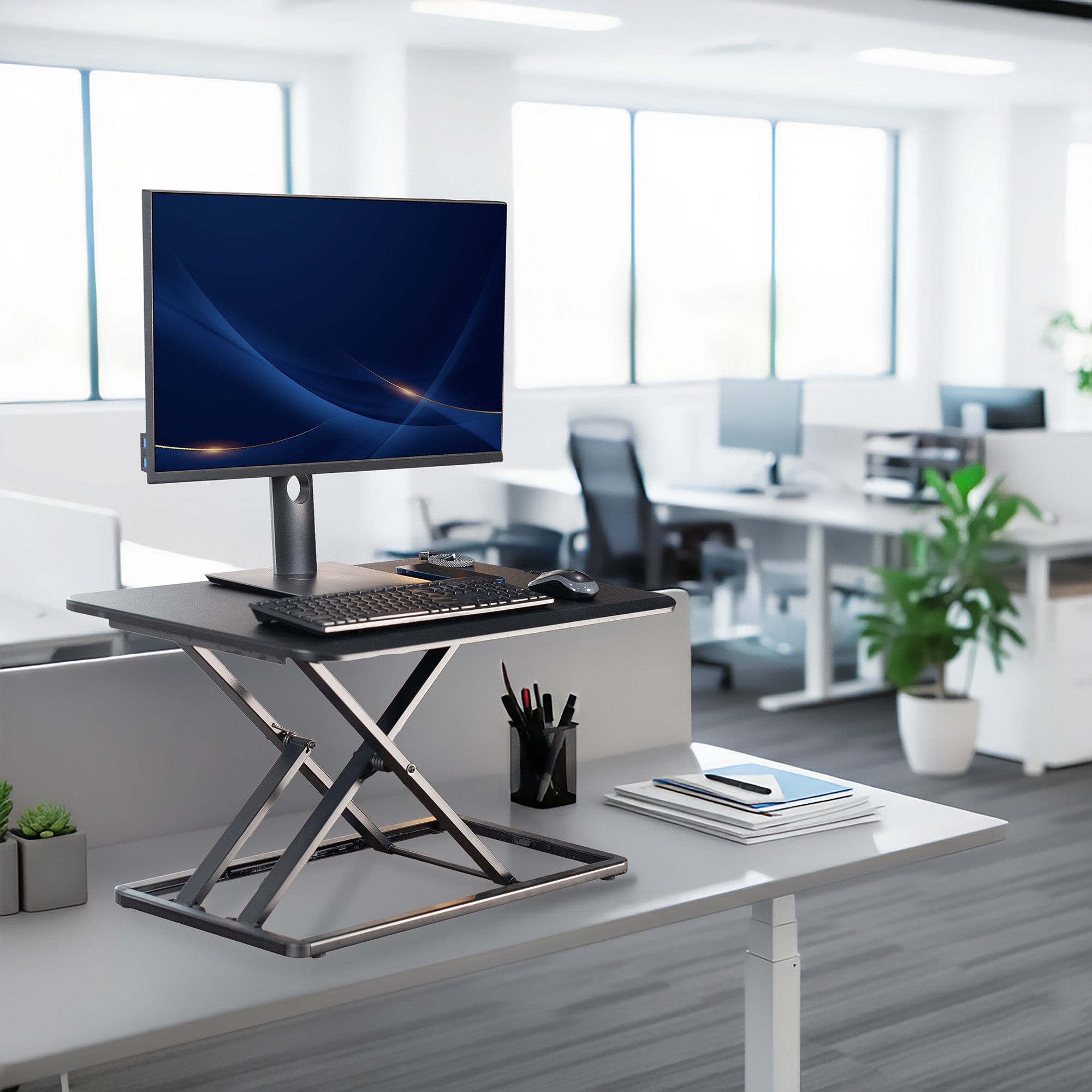 Heavy-duty height adjustable desk converter monitor riser.
