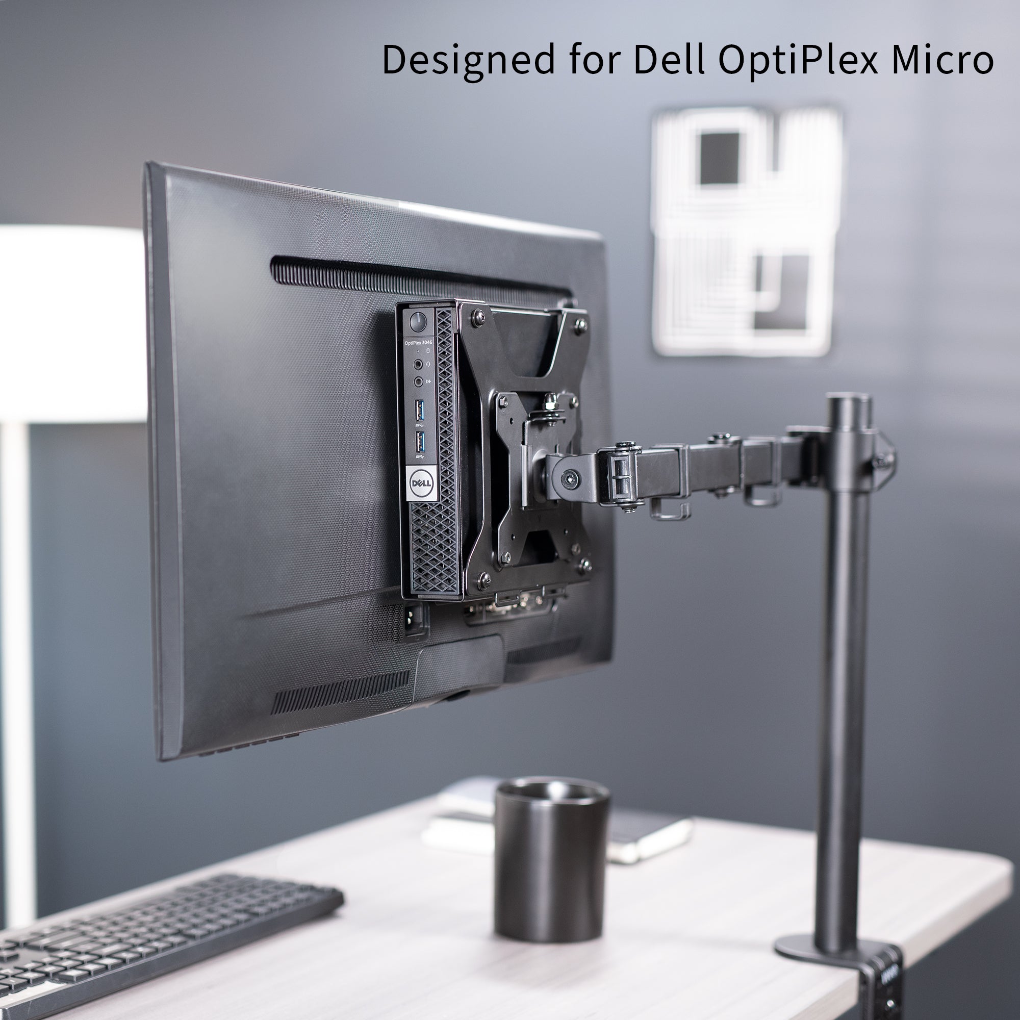 Mount Designed for Dell OptiPlex Micro mounted on back of monitor.