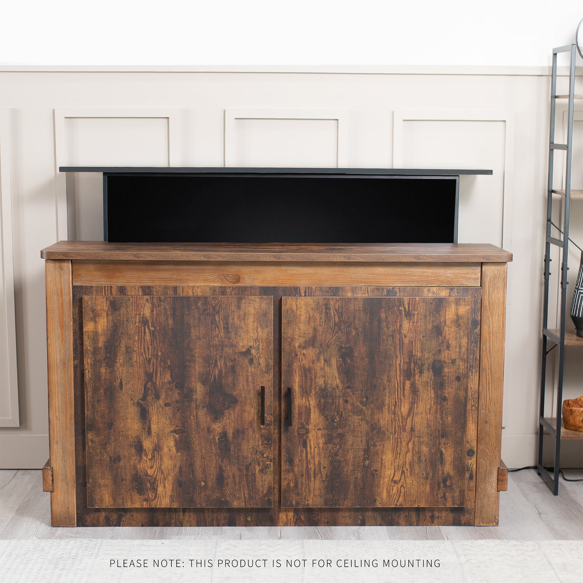 Wooden entertainment console concealing TV inside in living room setting.