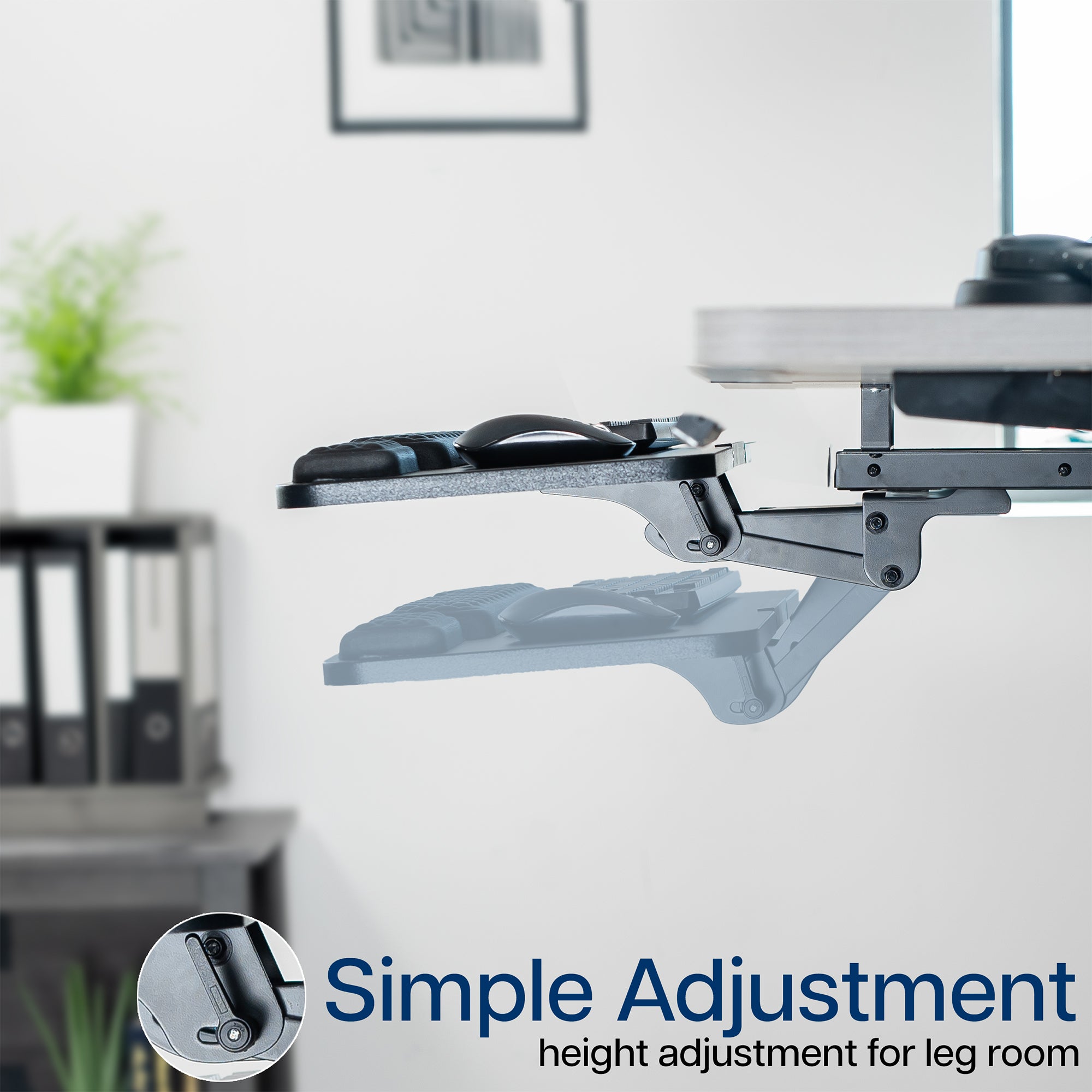 Adjustable under desk keyboard tray in a minimalist home office.