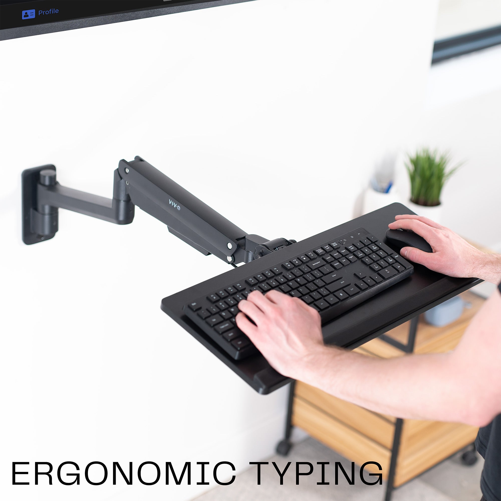 A wall mounted keyboard tray with a pneumatic mechanism