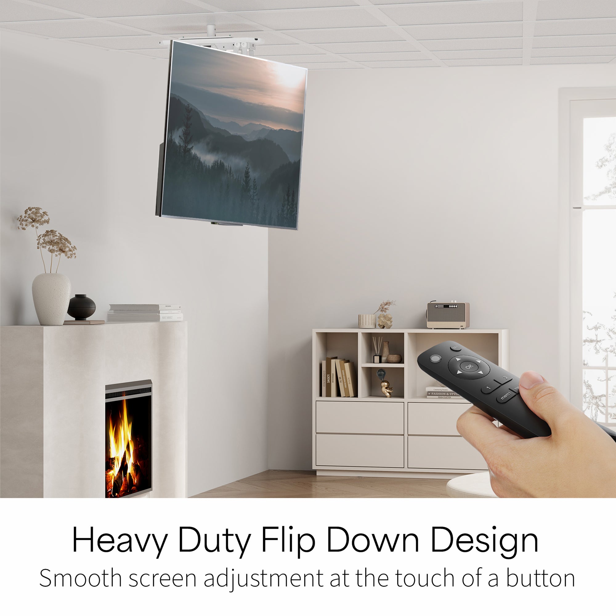 Modern living room with a TV mounted on the ceiling, a hand holding a remote control, and text about a heavy-duty flip down design.