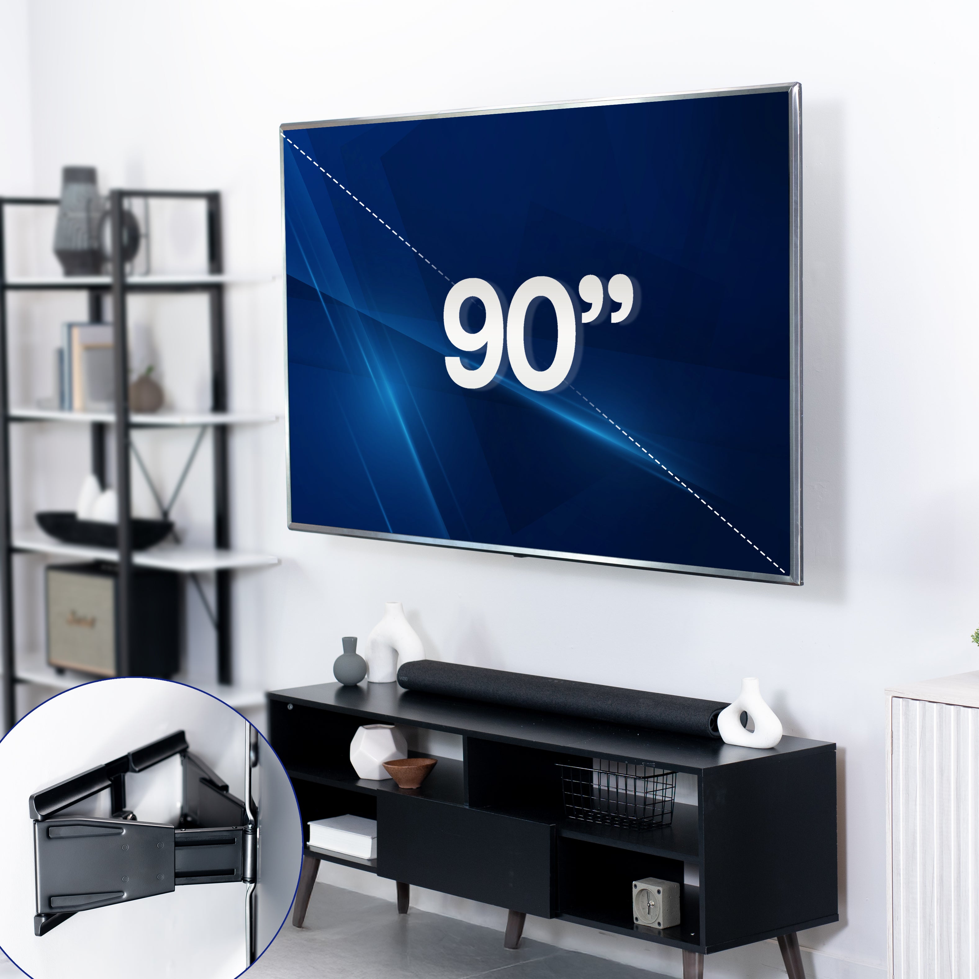 Large flat-screen TV displaying '90"' in mounted on a TV wall mount in a living room setting with a black entertainment console.