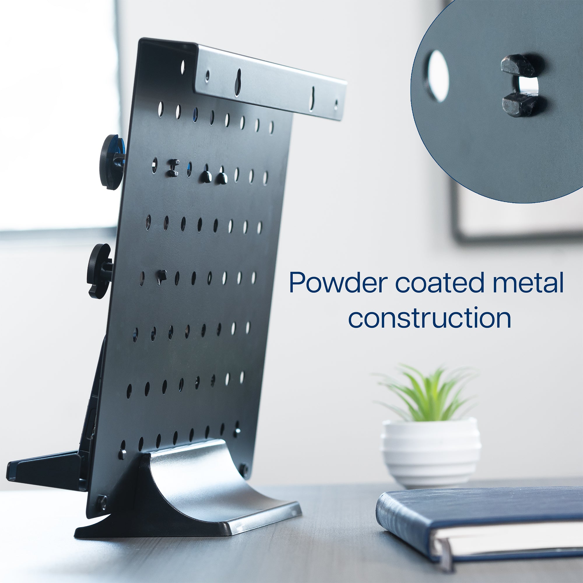 A black pegboard desk organizer with various slots and holders for office supplies and a mobile phone.