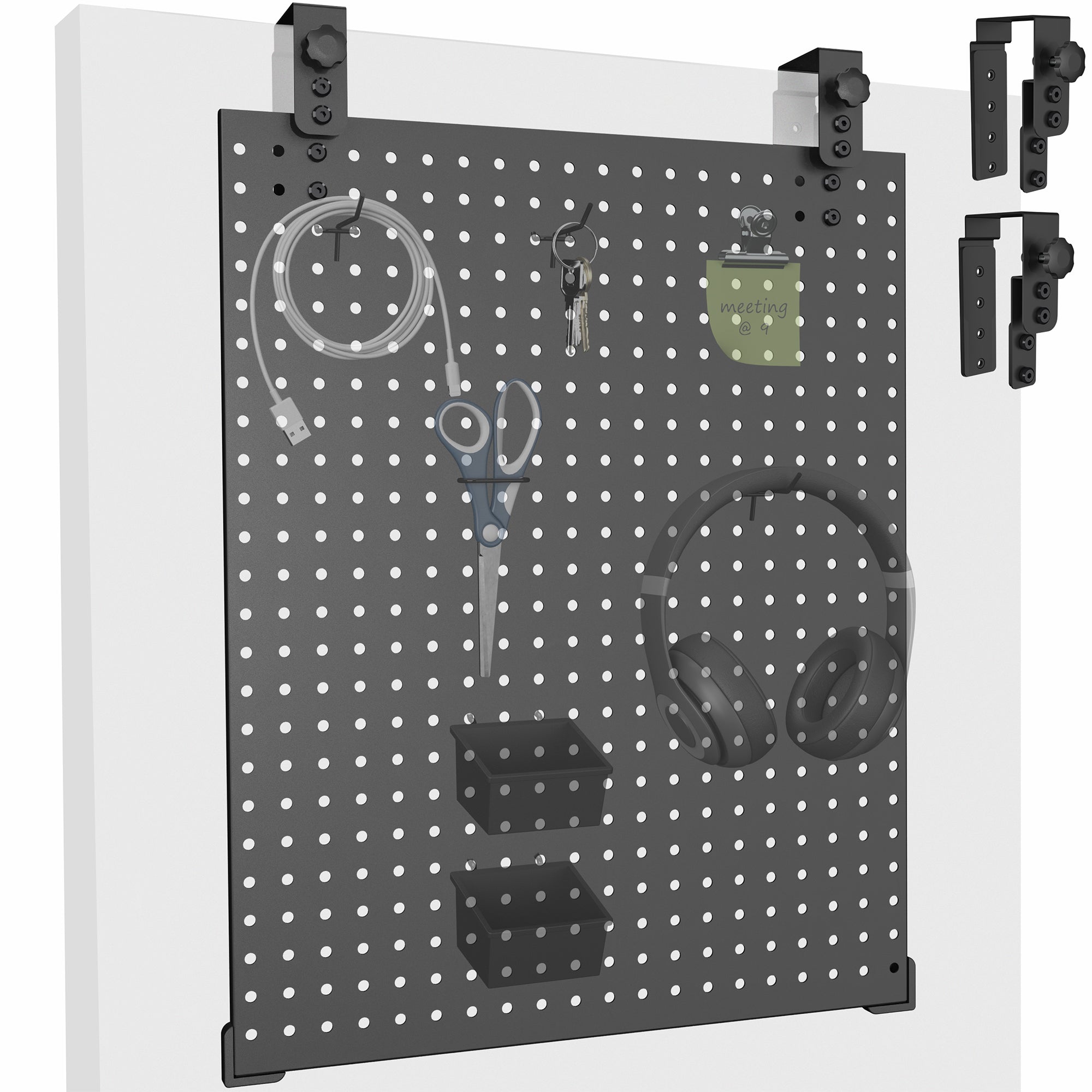 A black pegboard with various tools and equipment hanging on it, mounted on a white wall.