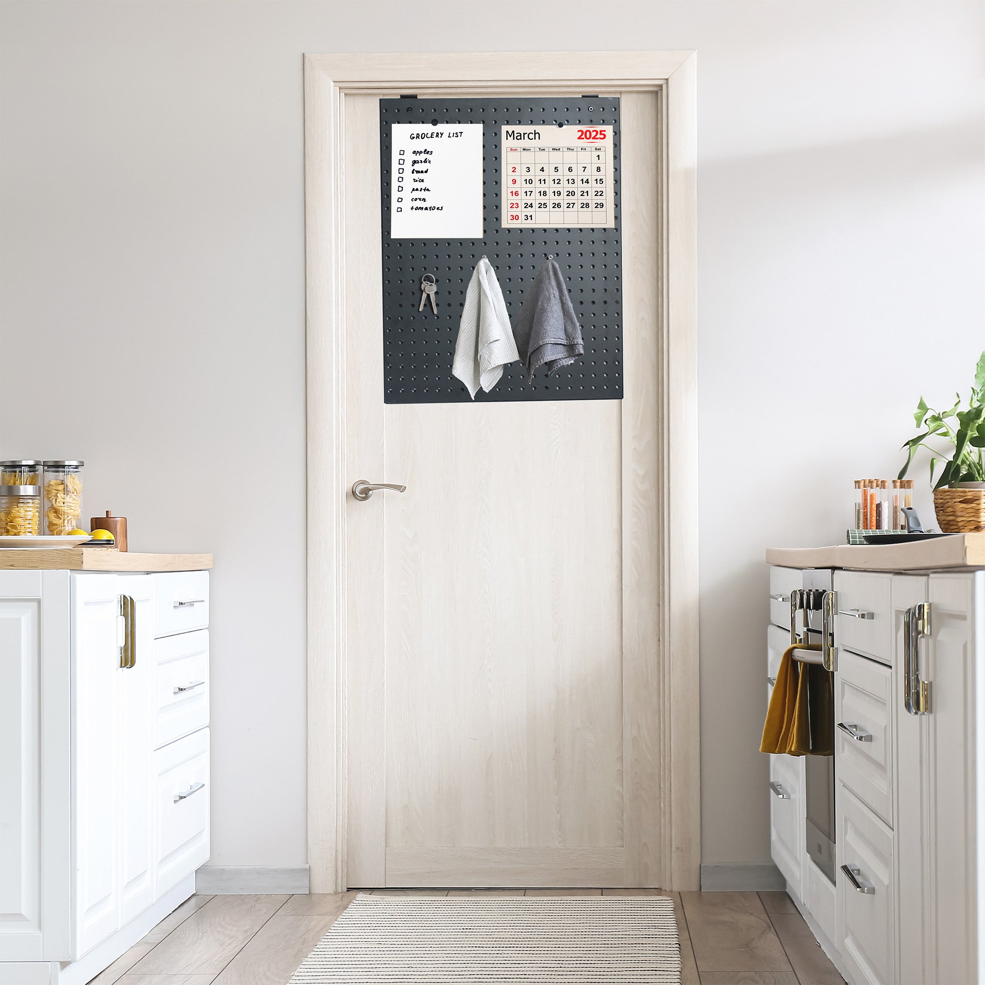 A black pegboard mounted on a kitchen door.
