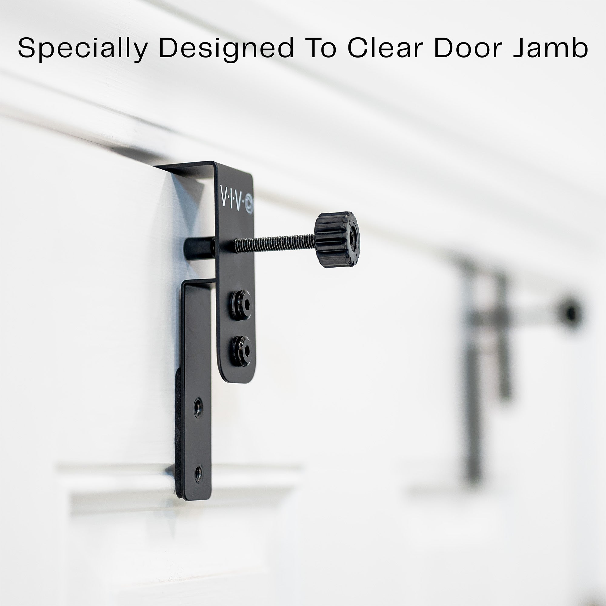 Hardware on a door with text to show doorjamb clearance.