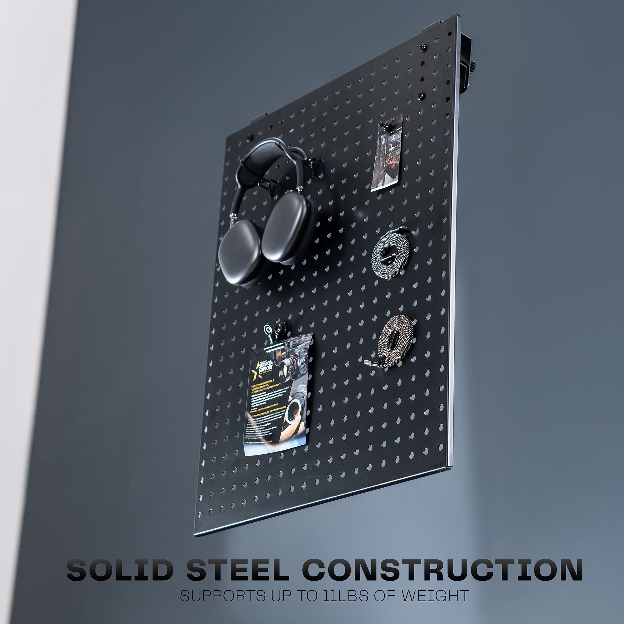 A black pegboard with heavy duty construction.