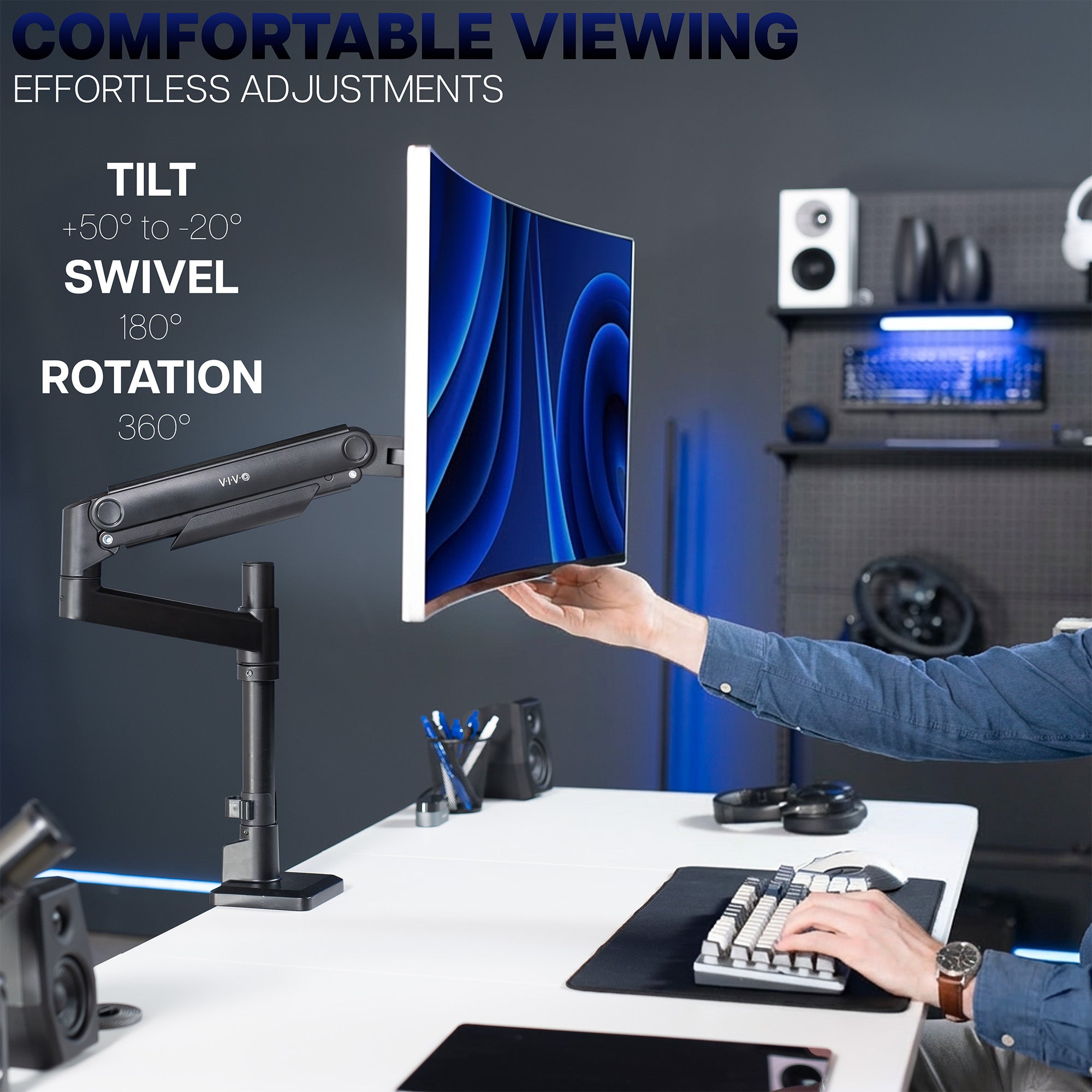 Adjustable monitor mount with a computer setup on a desk, emphasizing tilt, swivel, and rotation features.