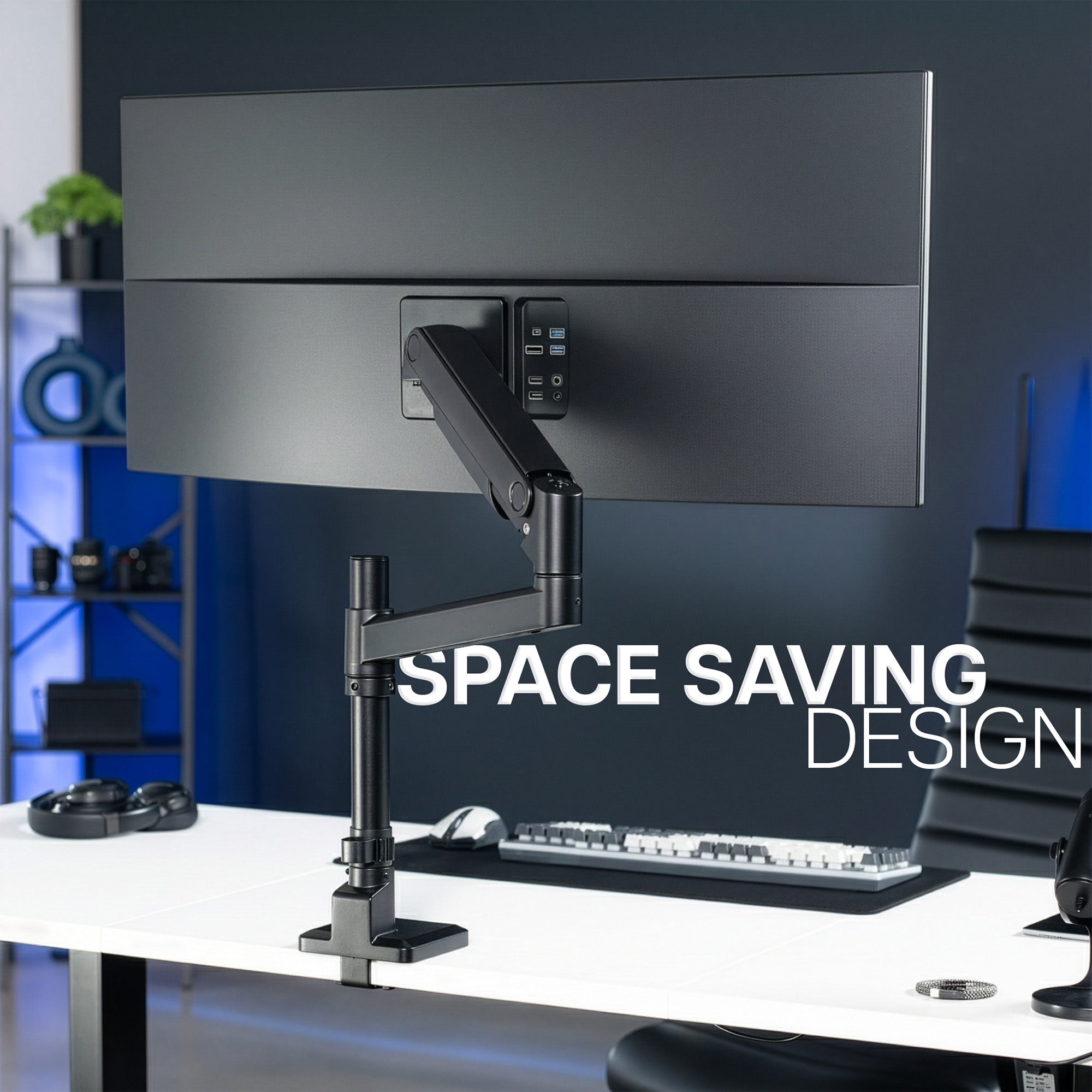 Space-saving monitor mount supporting an ultra wide monitor, on a desk in an office setting.