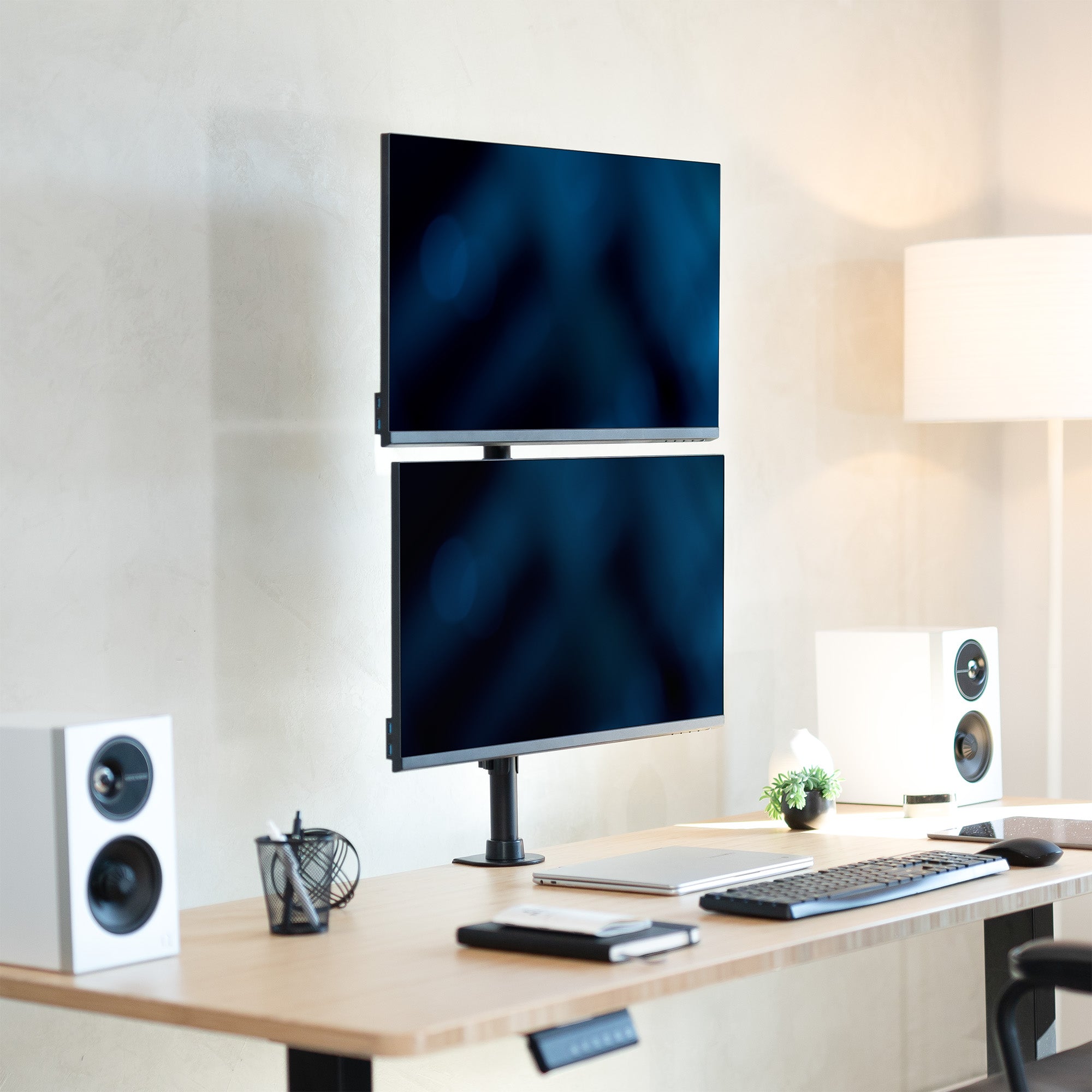 Sturdy adjustable vertical dual monitor ergonomic desk mount for office workstation.