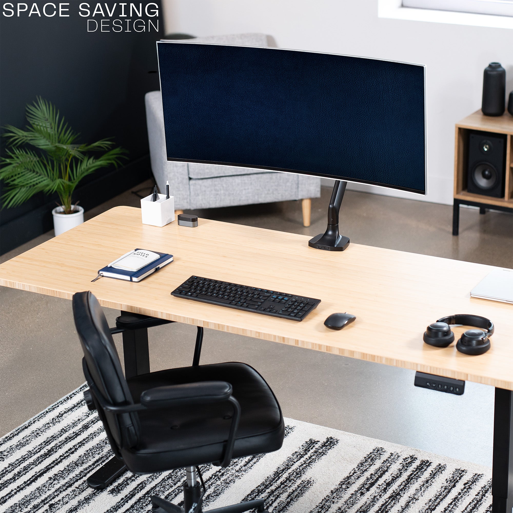 Single ultrawide monitor desk mount arm with a black finish in a modern office setting.