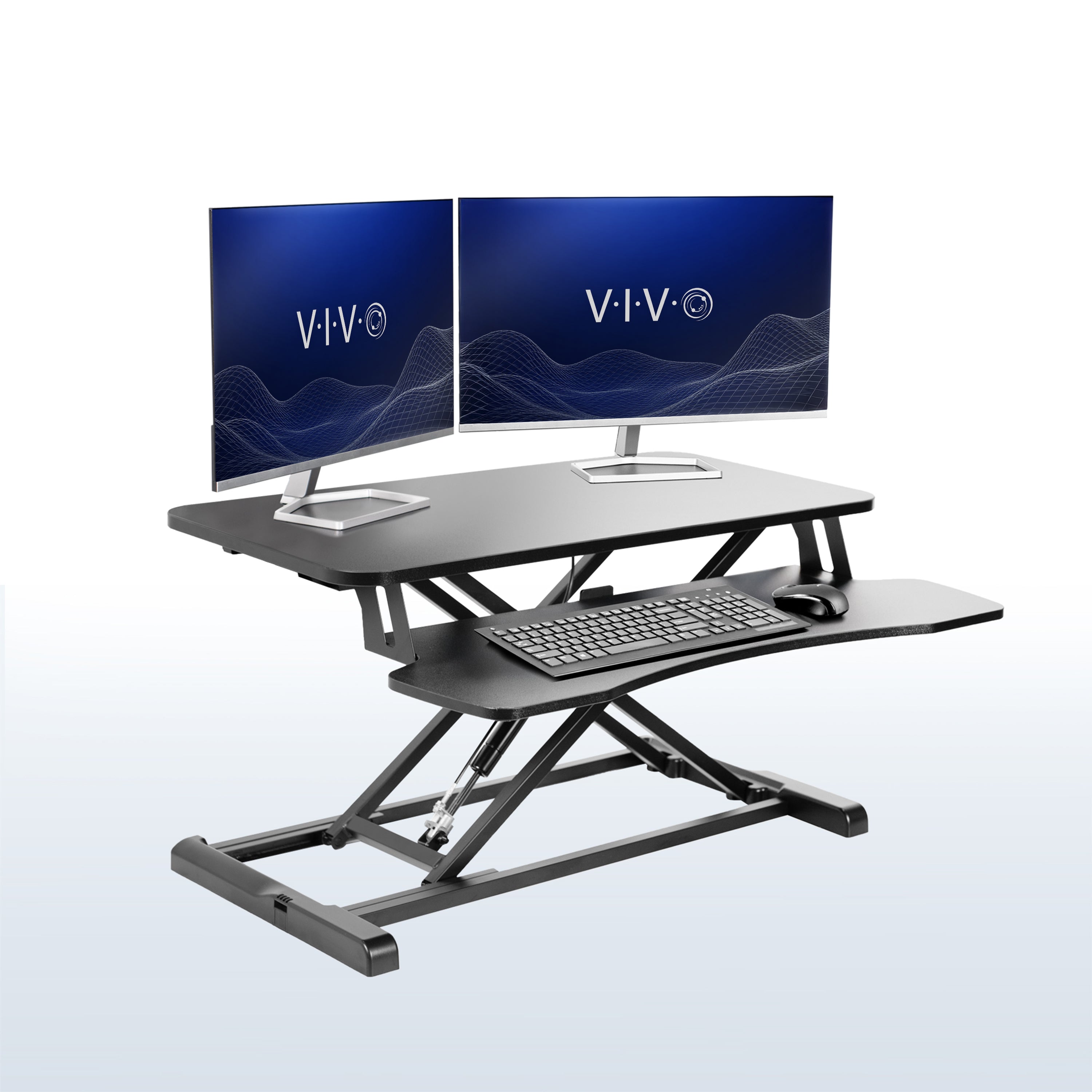 Sturdy height adjustable 2-tiered desk riser for ergonomic office workstation in office setting.