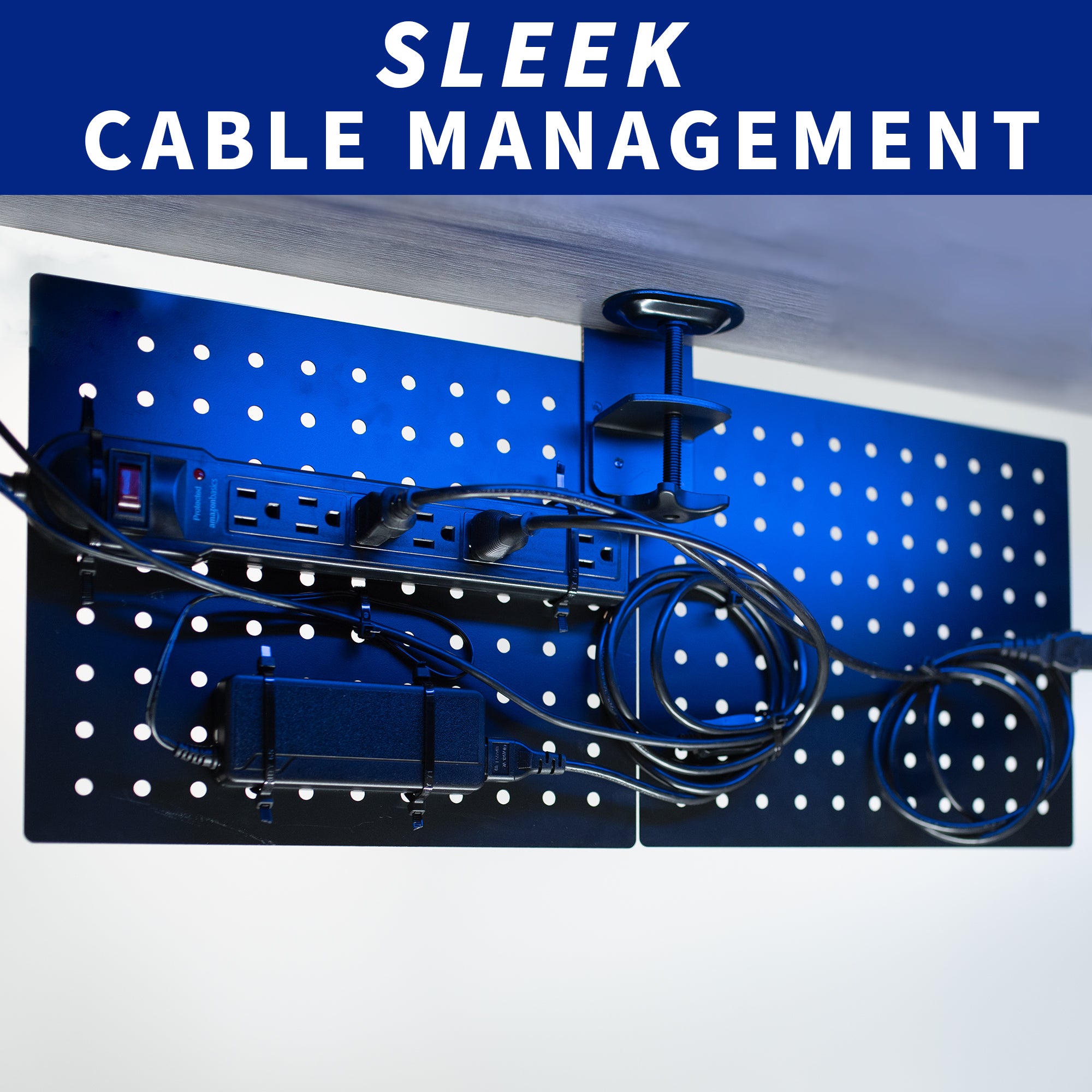 Clamp-on peg board under desk being utilized for cable management.