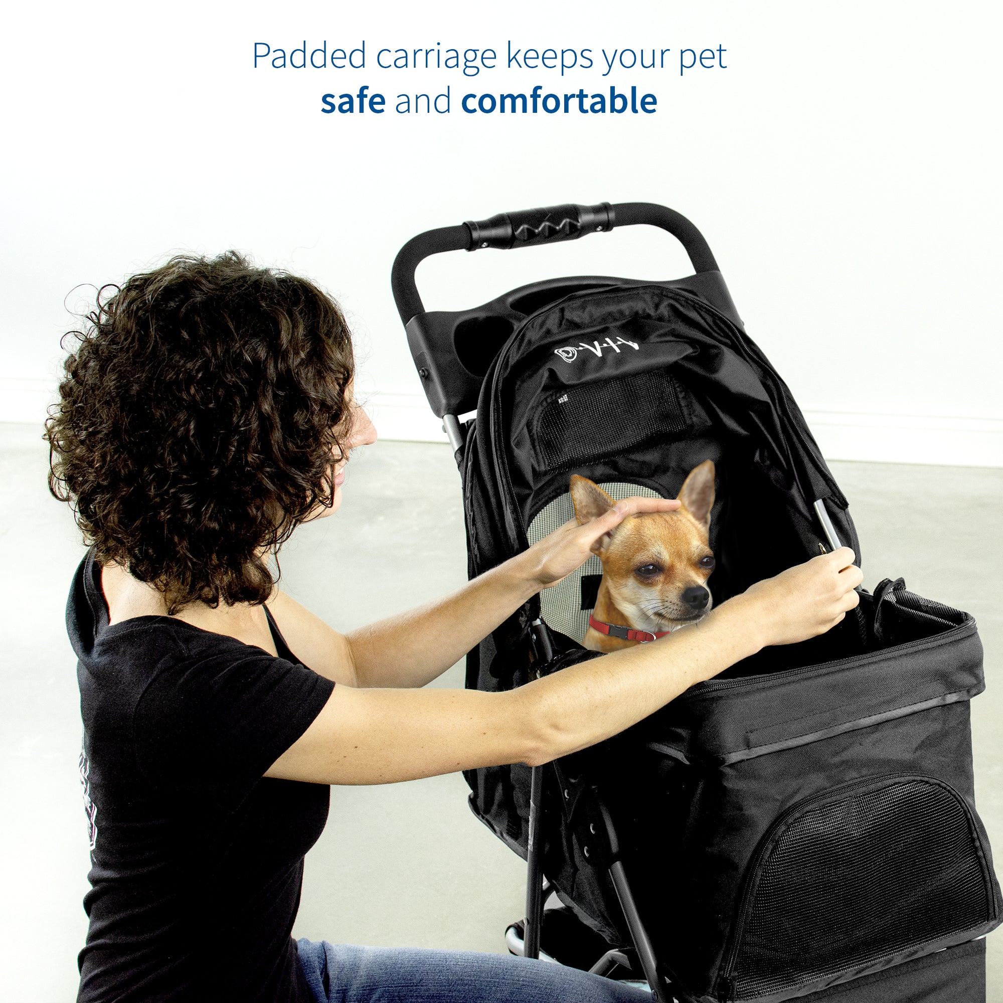 girl petting dog in Black Three Wheel Pet Stroller