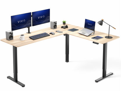 L-shaped desk with computer setup including monitors, laptop, and speakers on a white background