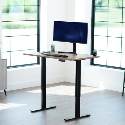 Sturdy ergonomic sit or stand active desk workstation with adjustable height using smart control panel.