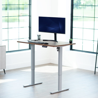 Sturdy ergonomic sit or stand active desk workstation with adjustable height using smart control panel.