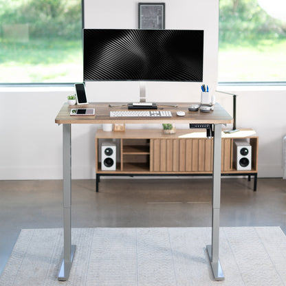 Sturdy ergonomic sit or stand active desk workstation with adjustable height using smart control panel.