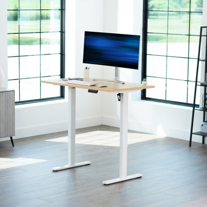 Sturdy ergonomic sit or stand active desk workstation with adjustable height using smart control panel.