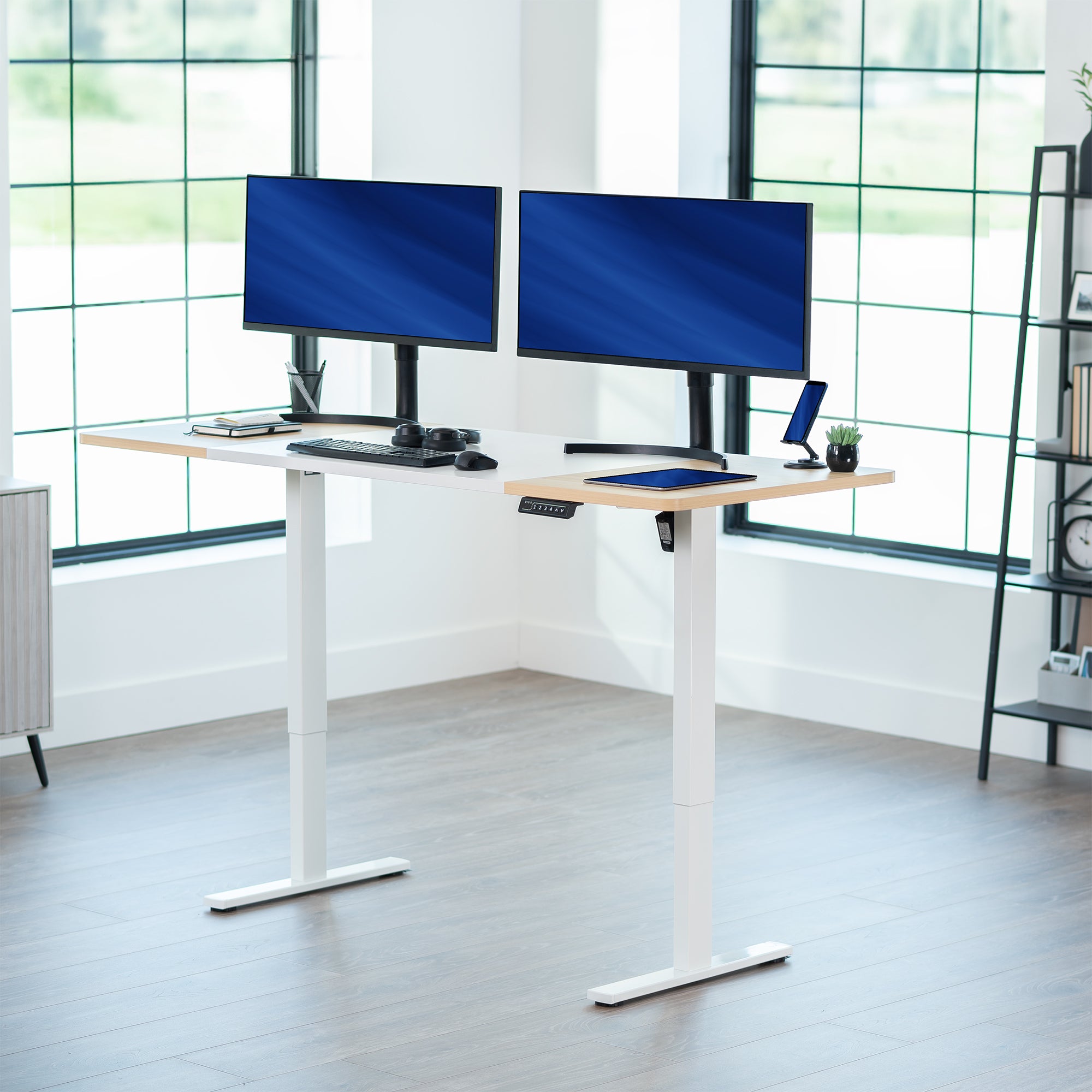 Large sturdy sit or stand modern desk with electric height adjustment options.