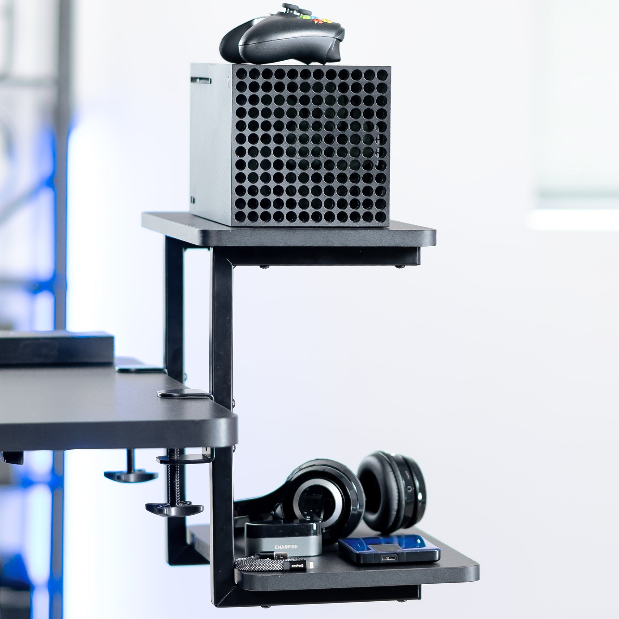 Above or below desk dual tier adjustable shelving system for flexible desk organization using convenient clamp-on storage. This versatile two-platform product can be arranged in multiple configurations to suit your workspace needs and aesthetic preferences.