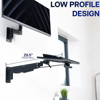 Wall mounted monitor with pneumatic wall mounted keyboard tray showing 'Low Profile Design' text.