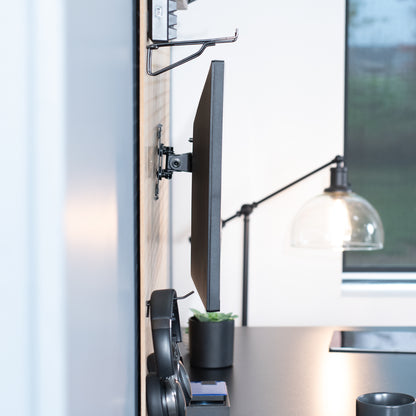 Pegboard mounted single monitor mount with tilt, swivel, and rotation.