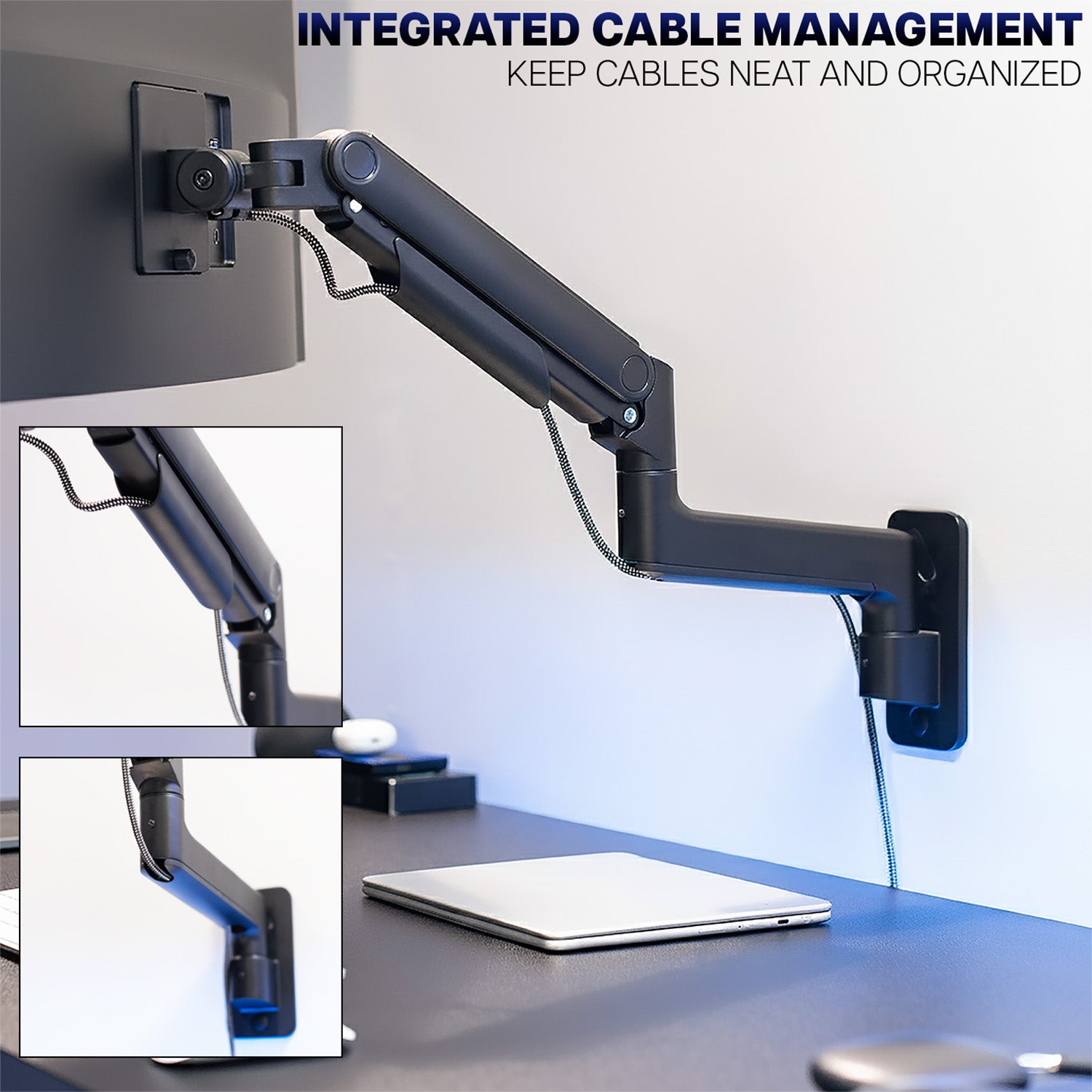 Wall-mounted monitor arm with integrated cable management system on a desk.