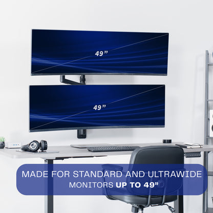 A black pneumatic arm dual ultrawide monitor wall mount holding two monitors in an office setting. 