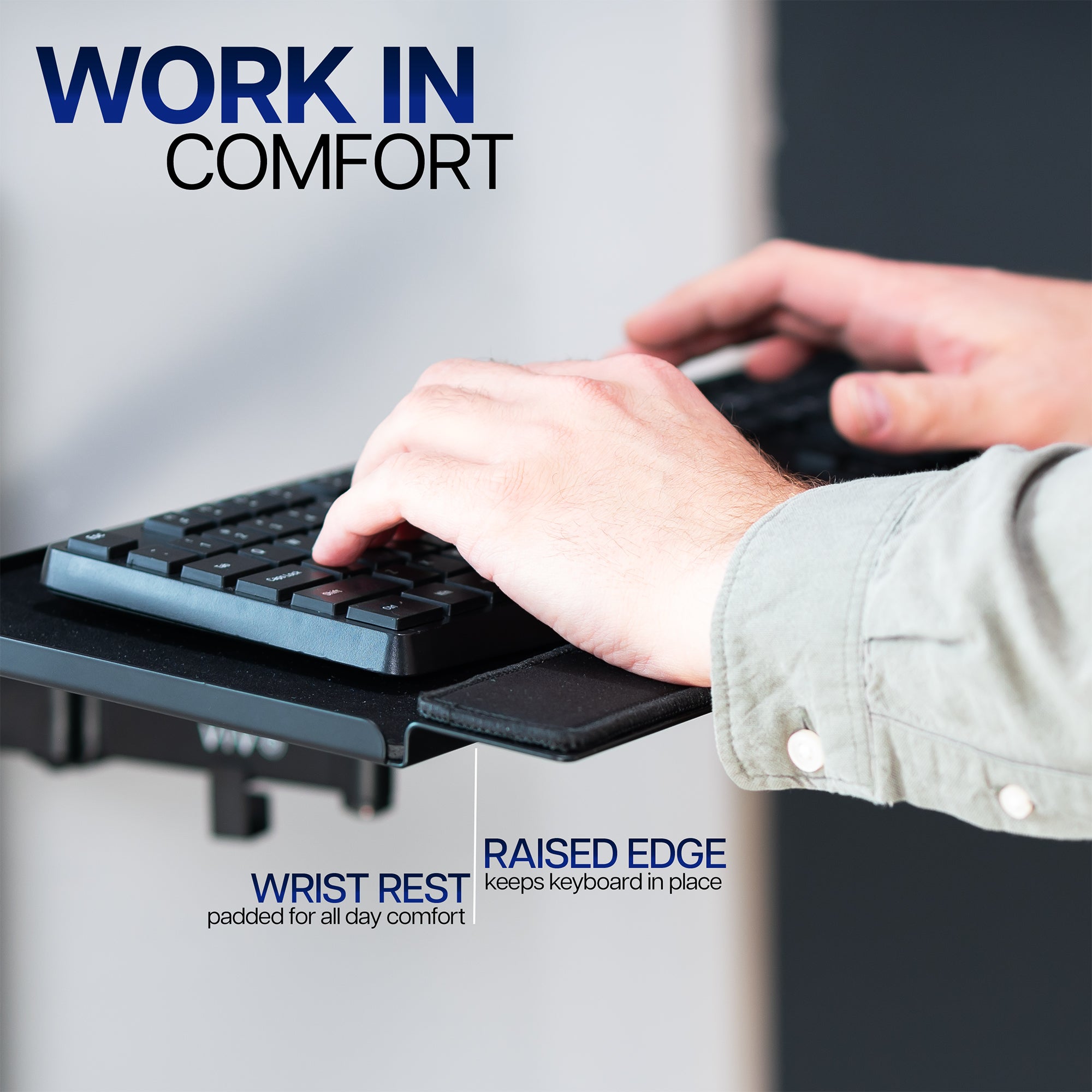 Person using a keyboard, with text 'Work in Comfort' and 'Raised Edge Wrist Rest'.