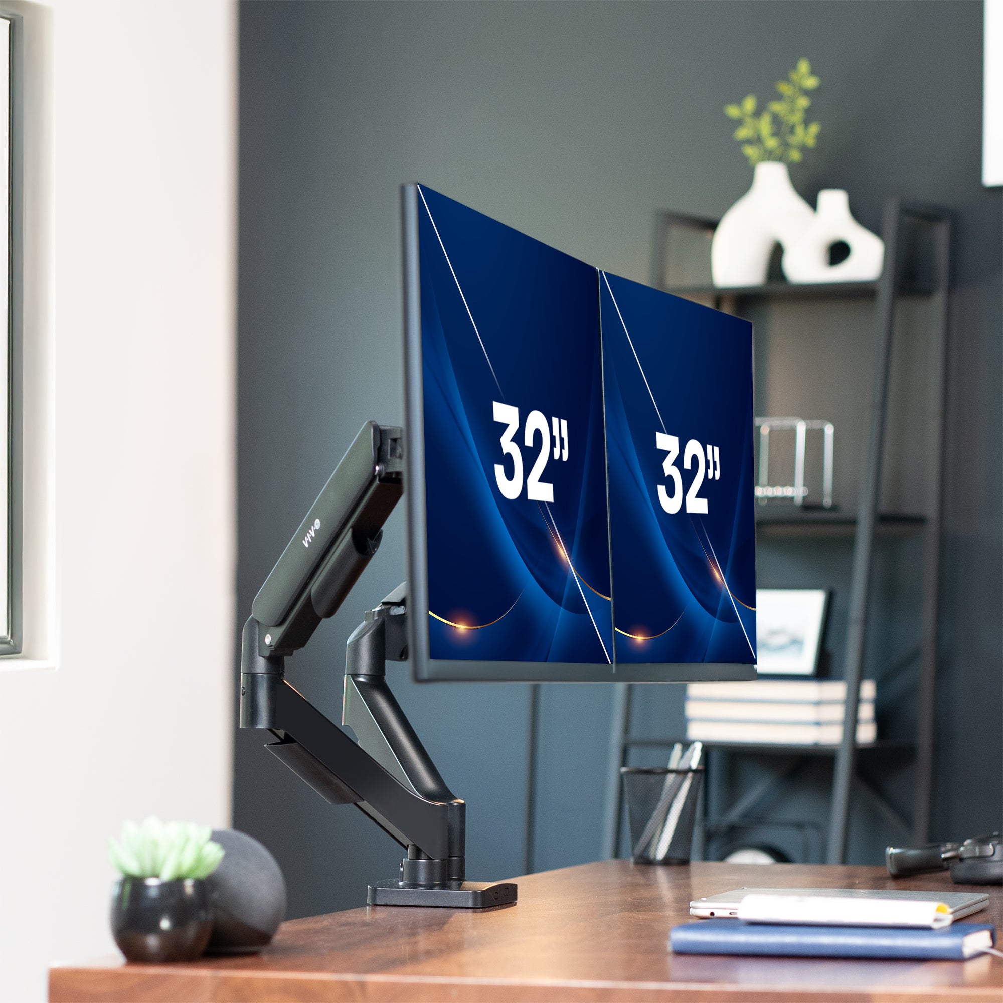 Dual mechanical arm monitor mount on a desk with a modern office background