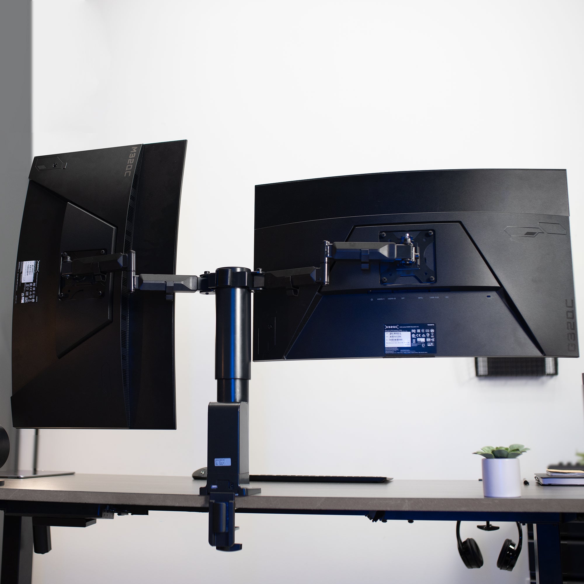Electric Dual Monitor Arm Mount in office space. 