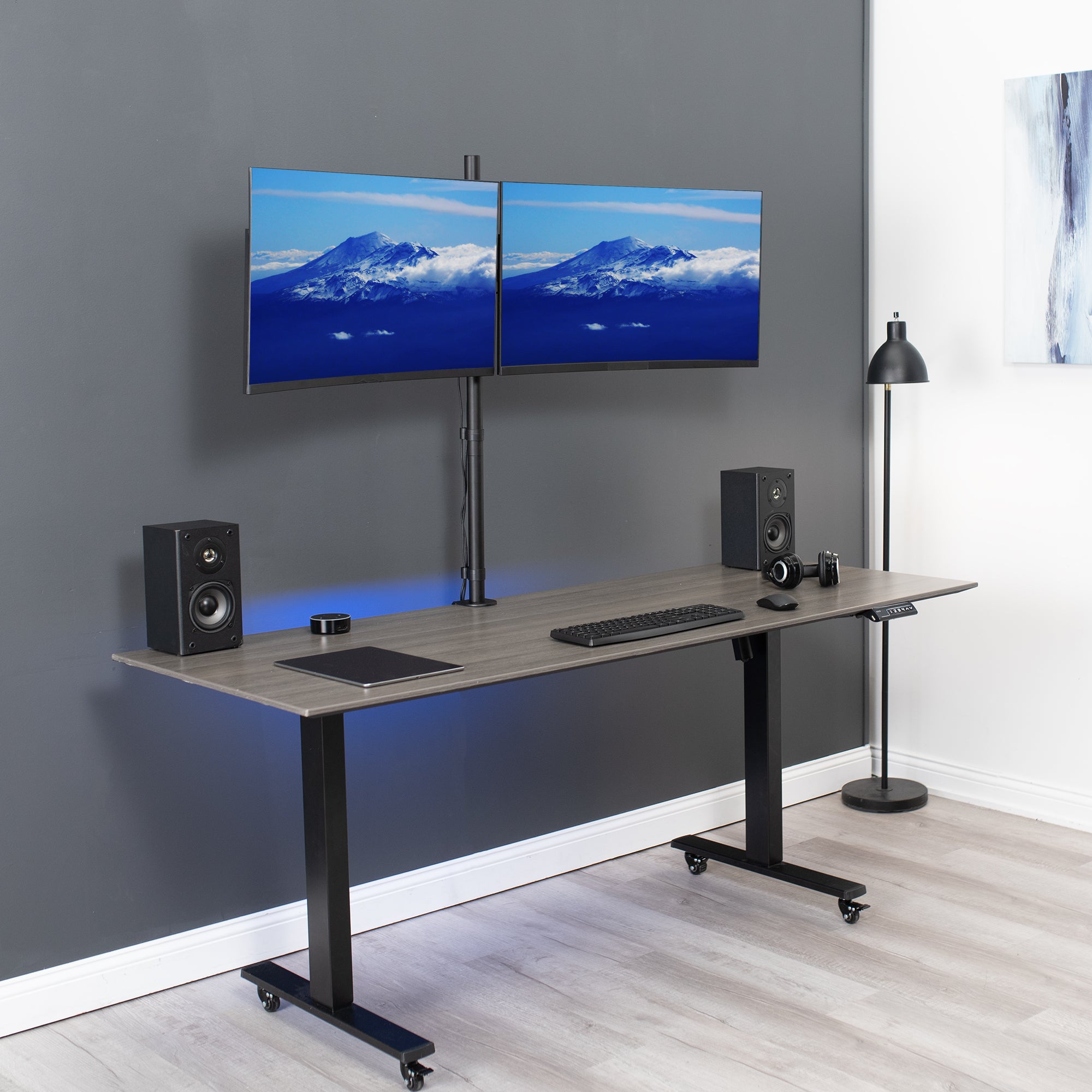Extra tall adjustable dual monitor ergonomic desk mount for office workstation.